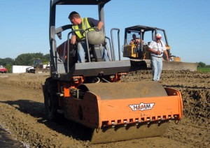 prezzi-tires Highway workers use a mixture of tire shreds and sand in road construction projects